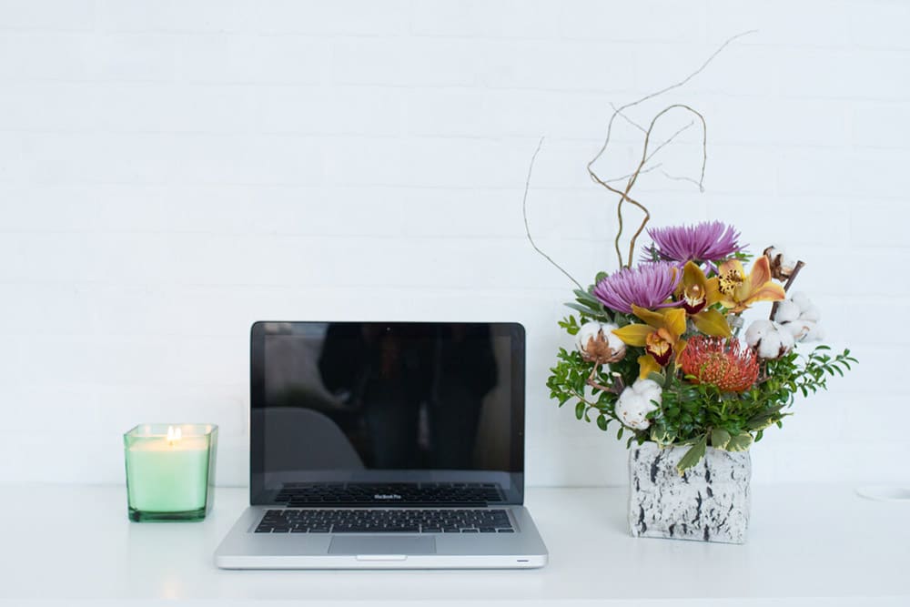 flower decor on laptop table portrait